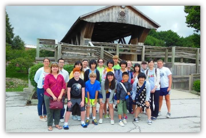 Group photo at covered bridge of youth delegation